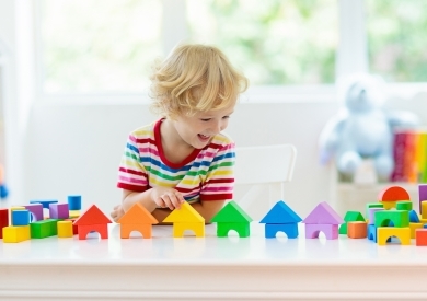 Child playing with colourful toys