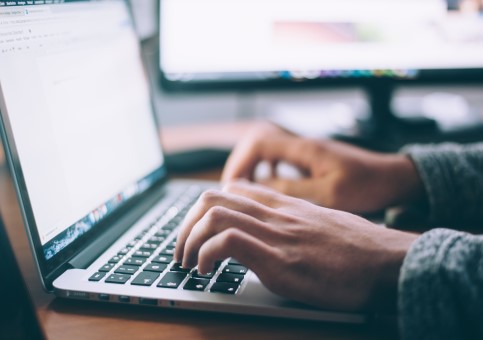 Person typing on a laptop