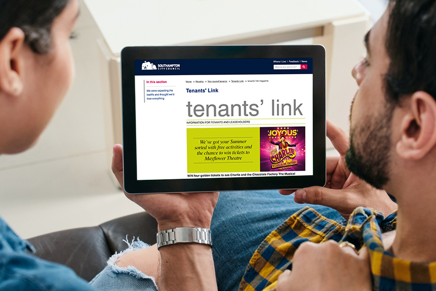 Two People Looking At Tenants' Link On An Ipad Two People Looking At Tenants' Link On An Ipad