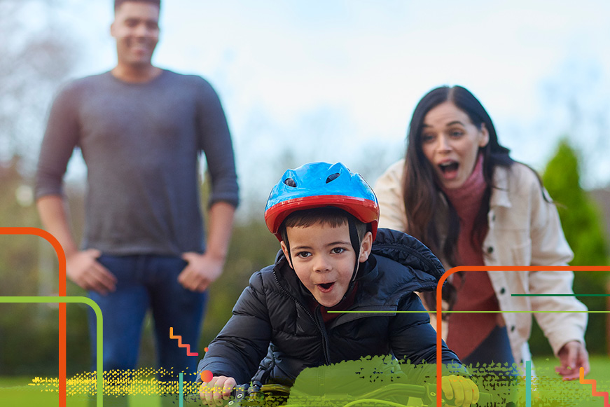 Foster parents and boy on bike