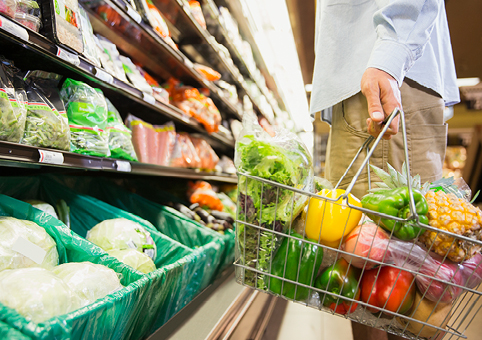 A shopping basket full of fruit and veg