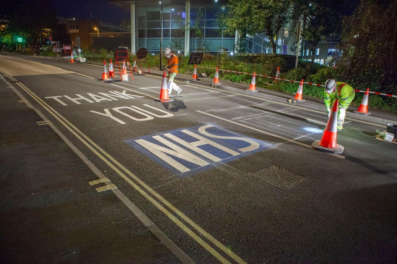 'Thank you NHS' being painted on the road outside the hospital