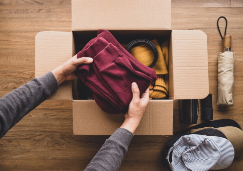 Box being packed with personal belongings