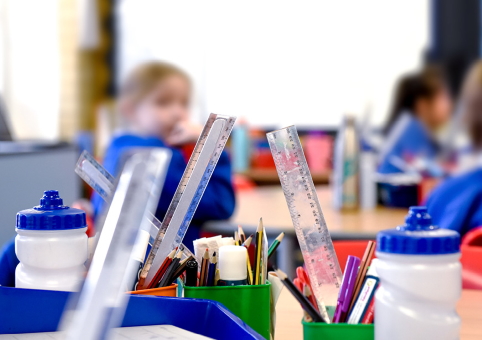 Children behind stationery