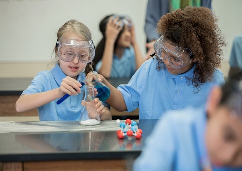 Two young children in a science class