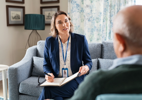 Elderly man talking to expert