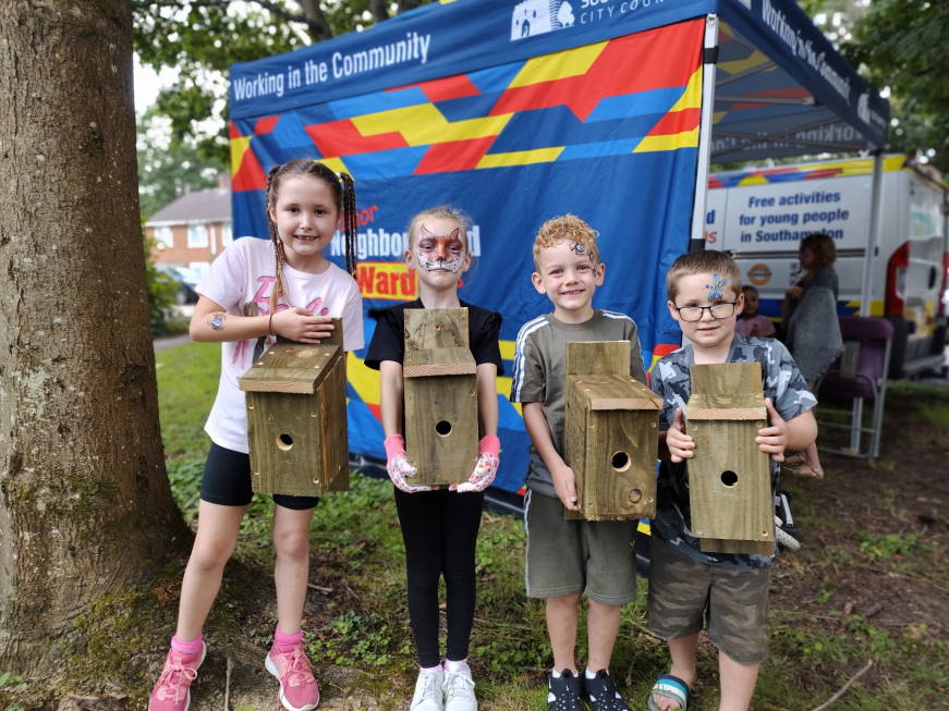 Four junior wardens with bird boxes