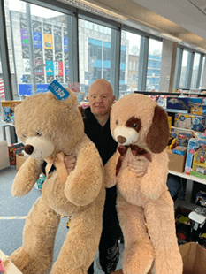 Richard with two large cuddly bears