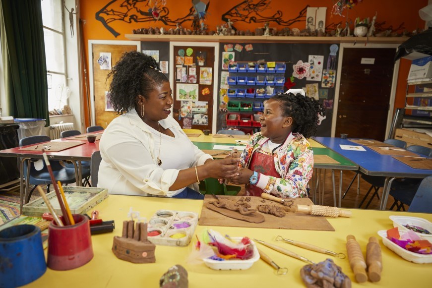 A woman and a child enjoying an arts and crafts activity