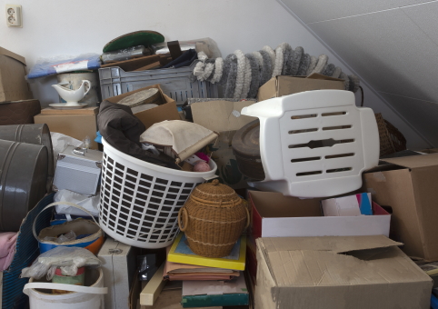 Belongings piled high in room