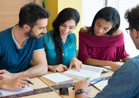 A group of young people working at a table