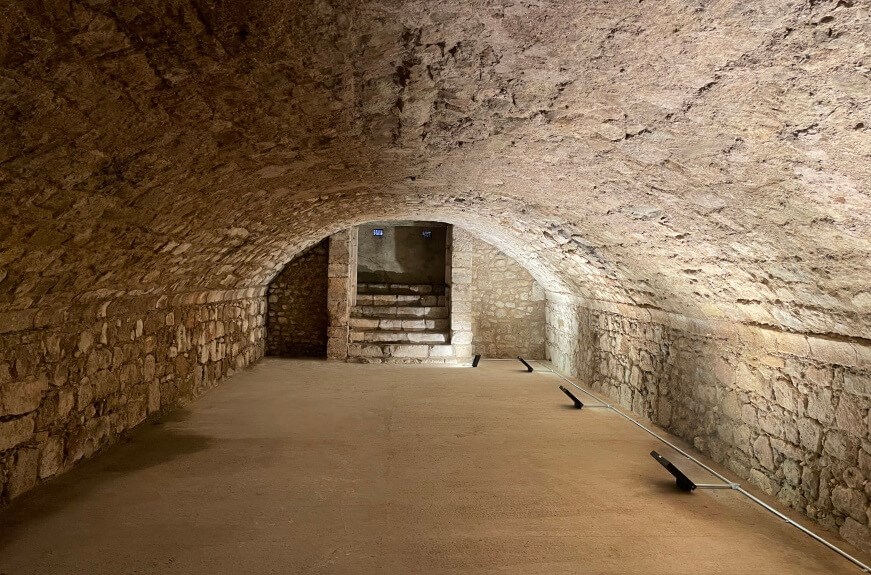 One of Southampton's medieval vaults. New lighting highlights the bare stone walls and ceiling