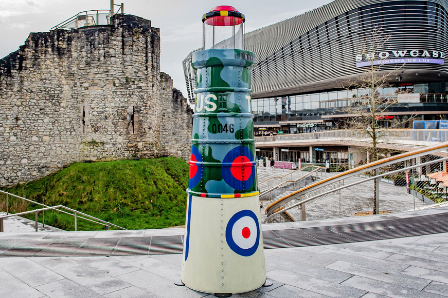 A lighthouse sculpture by the City Walls and West Quay A lighthouse sculpture by the City Walls and West Quay