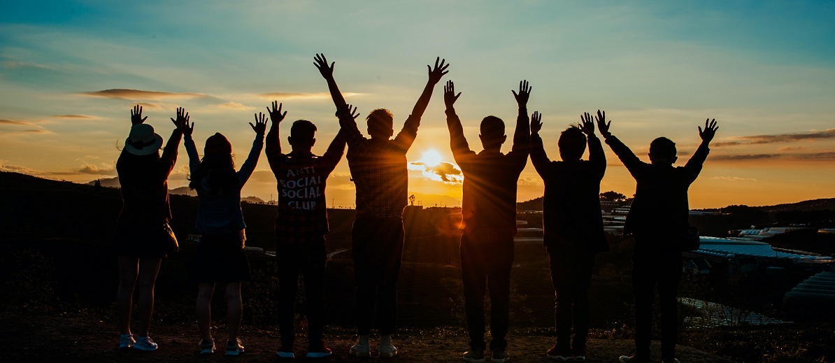 Group of young people looking at the sunset