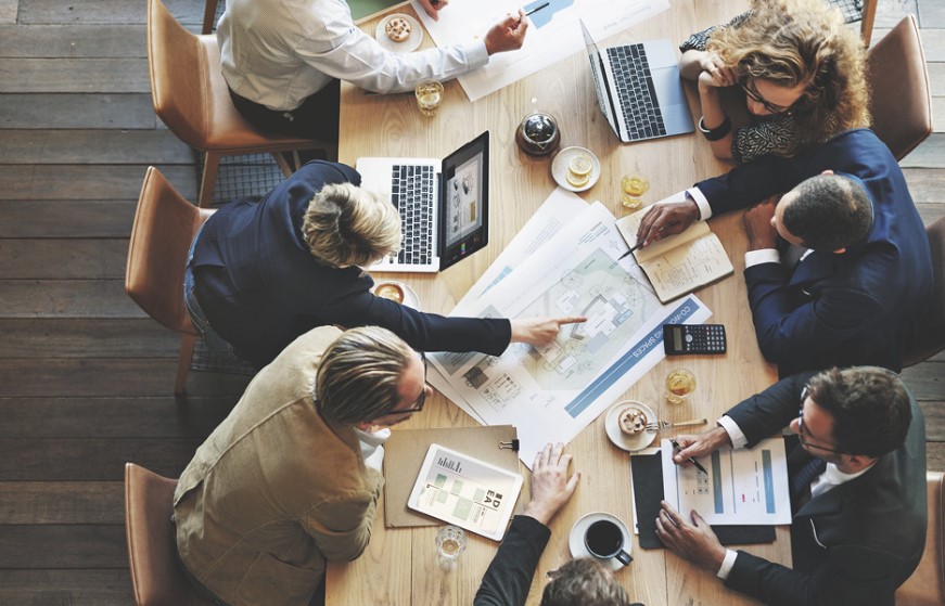 Group of people in a meeting discussing plans