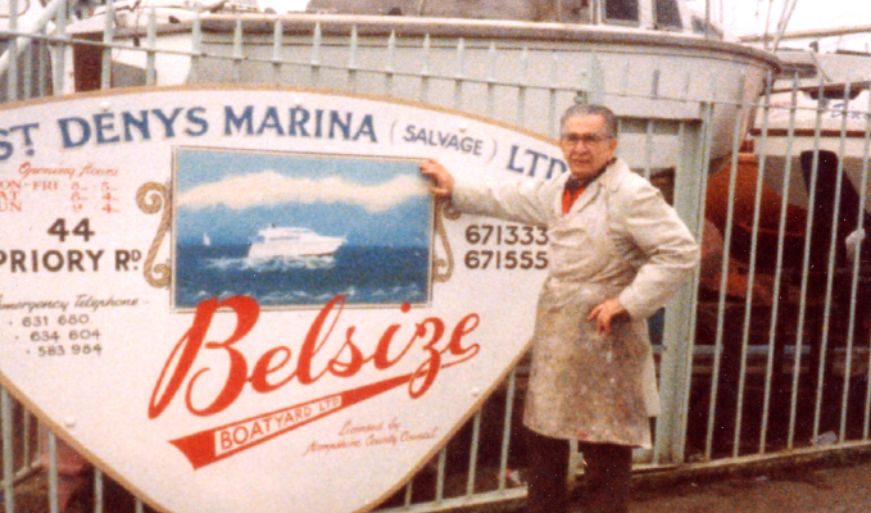 Man next to a sign stating "St Denys Marina" and "Belsize Boat Yard"