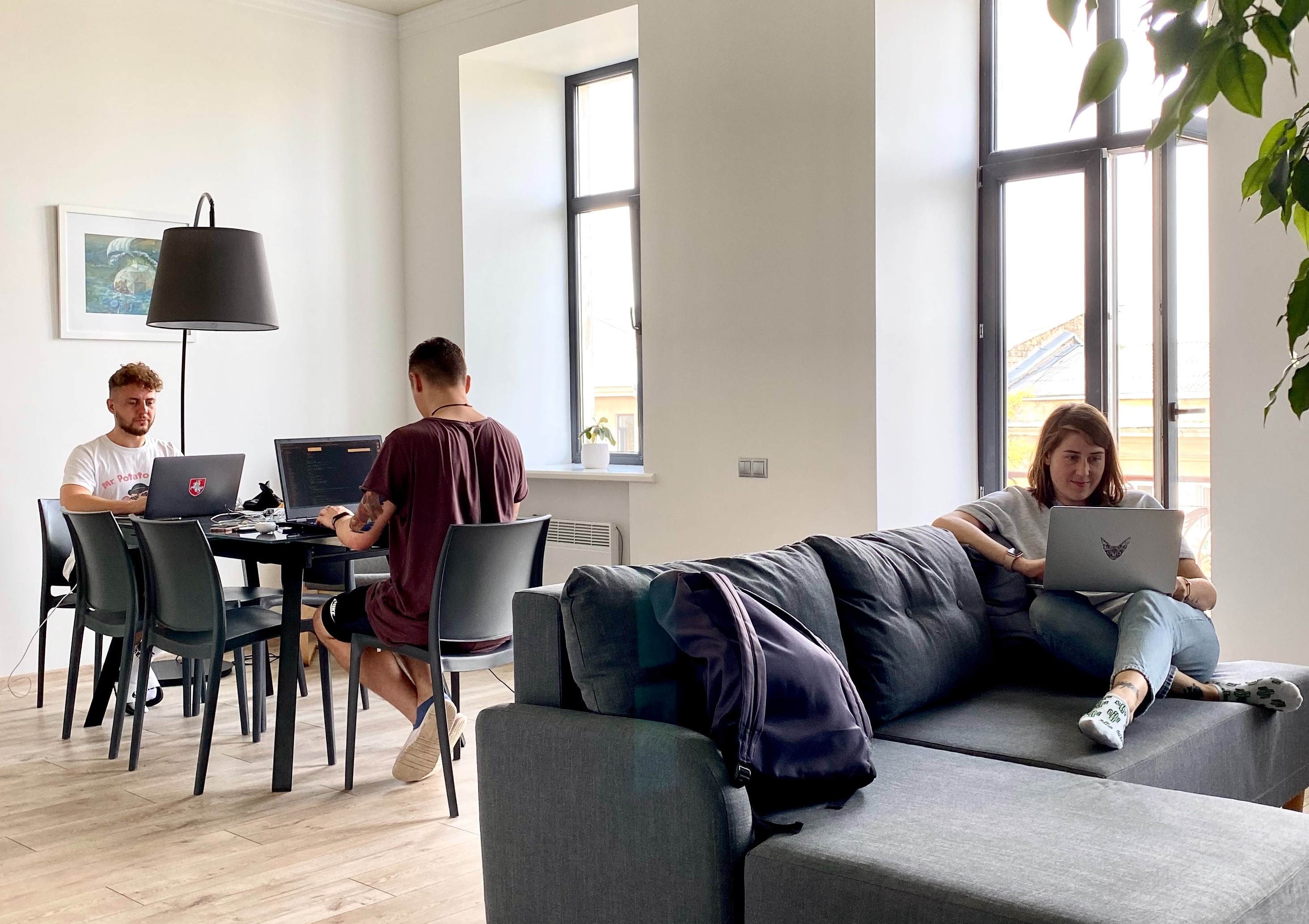 Individuals in a house separately on computers