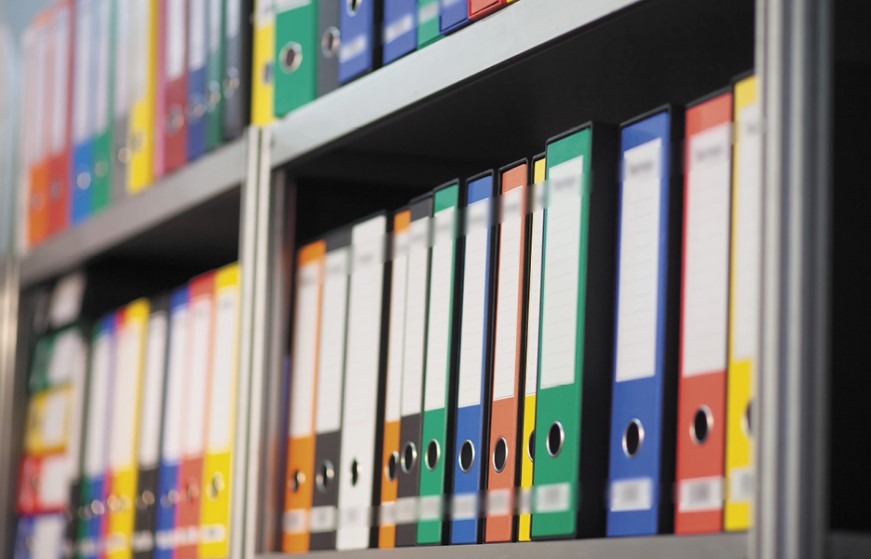 Document folders on a shelf