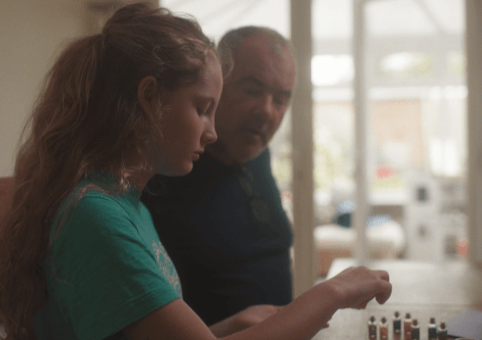 Man and girl doing arts and crafts