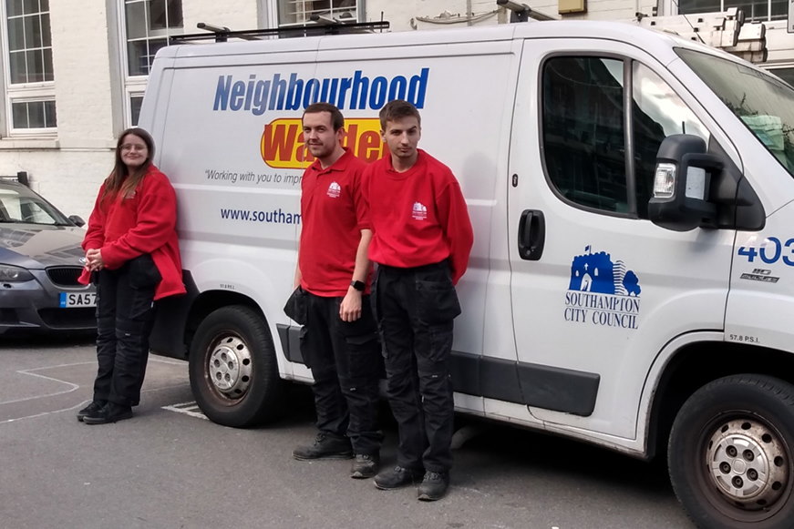 Three of the apprentices standing beside a Neighbourhood Warden van Three of the apprentices standing beside a Neighbourhood Warden van