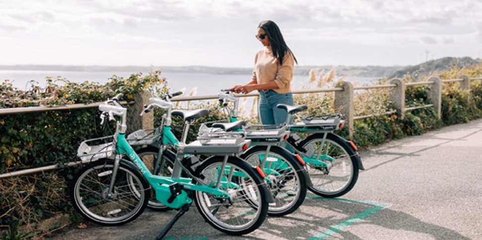 Woman Standing With Beryl Bikes Woman Standing With Beryl Bikes