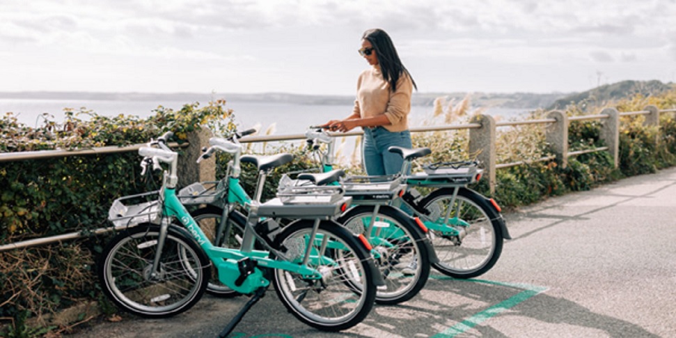 Woman Standing With Beryl Bikes