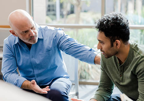 Adult speaking with a young person