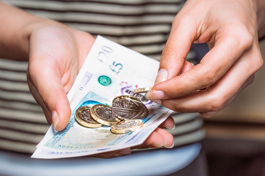 Someone holding some money Someone holding some money