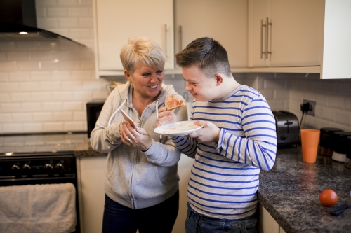 Woman And Boy With Downs Syndrome Istock 958872938