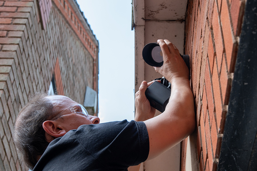 Man fitting CCTV camera