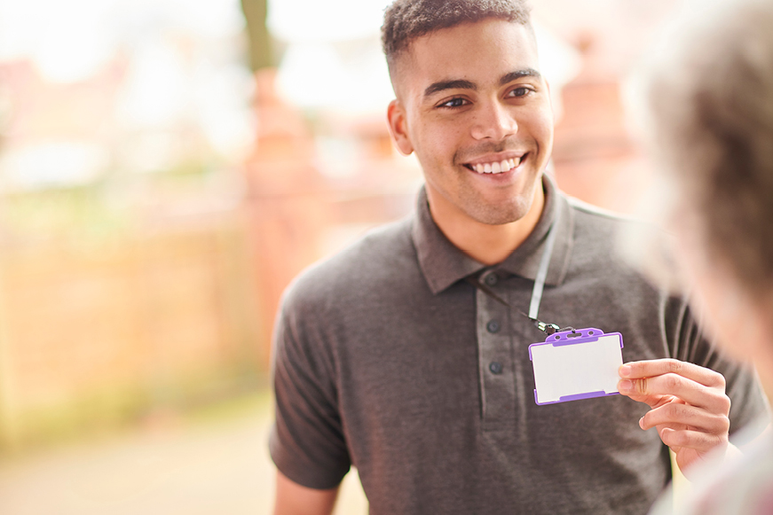 A man showing his ID to a tenant A man showing his ID to a tenant