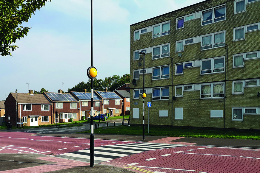 Street View Showing Zebra Crossing In Front Of Block Of Flats And Row Of Houses Street View Showing Zebra Crossing In Front Of Block Of Flats And Row Of Houses