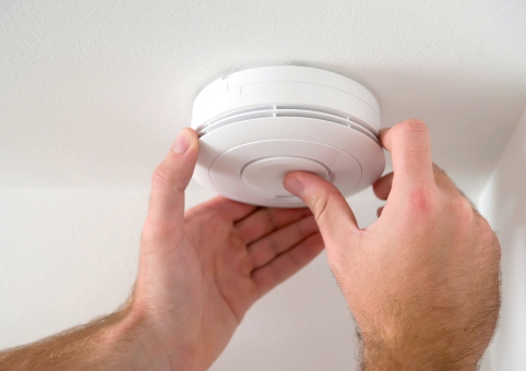 Smoke alarm being installed