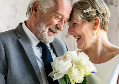 An older couple in wedding clothes