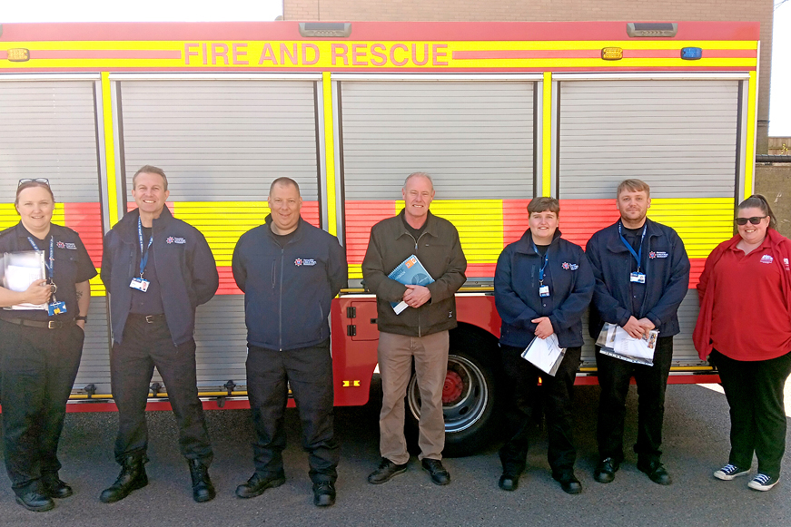 People In Front Of A Fire Truck